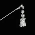 Detailed macro shot of vintage silver hair stick with hollow spheres and dangling tassels - Double Ball Prism Tassel (Silver 7) / Silver