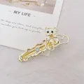 Detalle de pinza para el pelo con oso dorado, lazo, diamantes de imitación y diseño - Oso / Dorado