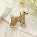 Detailed view of poodle brooch with brown rhinestones on a golden metal base - Champagne Dog