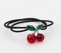 Elegant crystal cherry hair tie with red gemstones and green leaves on black elastic band - Hair Tie