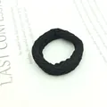 Close-up of thick black braided hair tie with high-elasticity textured knit design - Thick Black Braid