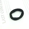 Detail of high-elastic black seamless scrunchie with soft velvet fabric texture - Thin Black
