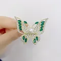 Elegant gold-plated butterfly brooch with emerald crystals and white pearls - Green Marquise Butterfly