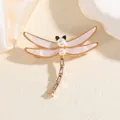 Elegante spilla a libellula dorata con ali in madreperla rosa e corpo in zirconi lucidi - Libellula Dorata