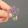 Handheld view of elegant purple wheat bouquet brooch with green gems and gold finish - XZ02-007 Purple