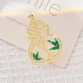 Gourd-shaped golden brooch with white rhinestones and green snake-inspired detailing - Gold 3