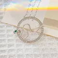 Silver snake brooch with green stones and pearl in a rhinestone circular frame - Silver 2