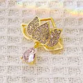 Elegant lotus flower brooch with pink teardrop crystal on white tweed background - Rhinestone Waterdrop Gem Style (XZ291) / Lotus Waterdrop Pink (XZ291)