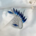 Close-up of elegant leaf brooch with blue marquise crystals and sparkling rhinestones - Blue Olive Branch Style