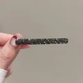 Close-up of sleek black rhinestone rectangular hair clip with shimmering crystals - Long Full Rhinestone Gunmetal #6