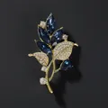 Exquisite gold orchid leaf brooch with navy blue crystals and sparkling rhinestones - Blue