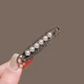 Detail of fishtail hair clip with six white pearls and shimmering dark rhinestones - Pearl Paperclip Gunmetal #19