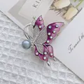 Macro shot of butterfly brooch with purple enamel wings and shimmering inlaid rhinestones - Purple Butterfly (XZ41-005)