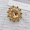 Elegant flower brooch with green crystals and amber stone on a vintage gold base - Champagne Flower
