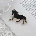 Close-up detail of a running horse enamel brooch pin in black and gold finish - Black Enamel Running Horse (Black Horse)