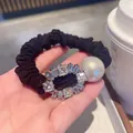 Elegant black scrunchie with large pearl and sparkling rhinestone embellishment - Oval Style