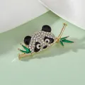 Detail of panda brooch with sparkling rhinestones and green bamboo in gold plating - Big Head Panda XZ237