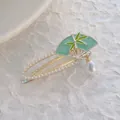 Chinese style bamboo leaf fan hair clip with green enamel and white pearls in gold finish - Bamboo Leaf Fan Style