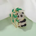 Detail of panda brooch with sparkling rhinestones and green bamboo leaves - Side View Panda XZ245