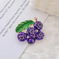 Artistic gold-plated blueberry brooch with green leaves and purple enamel fruit clusters - Blueberry
