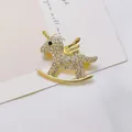 Detailed view of unicorn rocking horse brooch with gold base and sparkling rhinestones - Gold Rhinestone Pegasus (XZ289 Gold)
