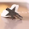 Star-shaped duckbill hair clip in gun black metal with dark grey rhinestones - Black