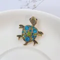Luxurious turtle brooch with blue and green crystals in antique gold finish on ceramic - Blue Style (XZ129 Blue)