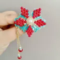 Horquilla de flor en esmalte azul con perla blanca y borlas doradas largas - Flor de Granada Clásica Roja (F01-012 Flor Roja)