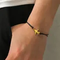 Bracciale intrecciato nero minimalista con ciondolo a forma di aereo in oro lucido - Ciondolo Oro - Corda Nera