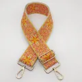 Bandoulière ethnique brodée orange avec motifs floraux et mousquetons en métal doré poli - Taille 26