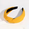 Cross-knot mustard yellow ribbed fabric headband with minimalist stylish design - Yellow