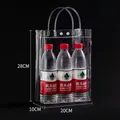 Vertical transparent PVC gift bag with white button and handles measuring 28x20x10cm - 20x10x28cm