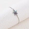 Bracciale tartaruga con zirconi colorati e ciondolo su catenina a maglia argento - Oro Bianco
