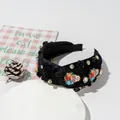 Detail of black velvet headband with skull ornaments and rhinestones for Halloween - Knot Style / Black