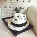 White straw beach hat with blue palm tree print and black ribbon for children - White