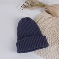 Detail of navy blue ribbed knit hat for kids with thick texture in lifestyle setting - Navy Blue