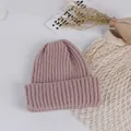 Detail of dusty pink ribbed knit beanie with thick fold-up cuff for winter warmth - Dusky Pink