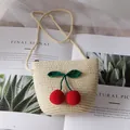 Straw woven crossbody bag for kids featuring handmade crochet cherry decor in beige - Beige