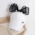 White girls baseball cap featuring a large black lace bow and elegant pearl accents - One Size / White