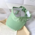 Light green open top sun hat for kids with embroidered smiley face and frayed brim - One Size / Green