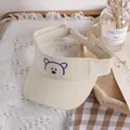 Kids cream open top sun hat with purple embroidered bear pattern and adjustable strap - One Size / Beige