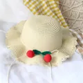 Handmade beige straw sun hat for children featuring red crochet cherry decorations - Straw Hat / Beige