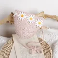 Light pink woven straw crossbody bag for girls featuring three white daisy flower decorations - One Size / Pink
