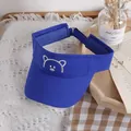 Kids blue sun visor hat featuring a cute white cartoon bear embroidery and open top - One Size / Sapphire Blue