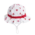 White cotton baby sun hat with strawberry print, red bow, and adjustable chin strap - 48cm / White
