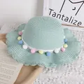 Light green straw hat for girls with colorful pompoms and wavy lace brim detail - One Size / Mint Green Hat