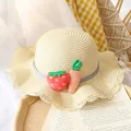 Kids beige straw sun hat with wavy brim and cute strawberry carrot plush decor - Straw Hat / Beige
