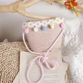 Handmade pink woven straw shoulder bag for girls with colorful pompoms and daisies - One Size / Pink Bag