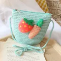 Mint green woven straw crossbody bag for girls with strawberry and carrot plush charms - Bag / Lake Blue