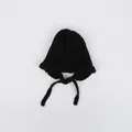 Black knit baby beanie with ruffle edges and ties for winter warmth - One Size / Black